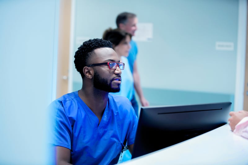 Male nurse using LGI Emergency Redirection to redirect patient to partner clinic