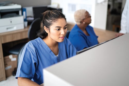 lgi-workforce-pro-time-and-attendance-female-nurse-behing-desk-banner