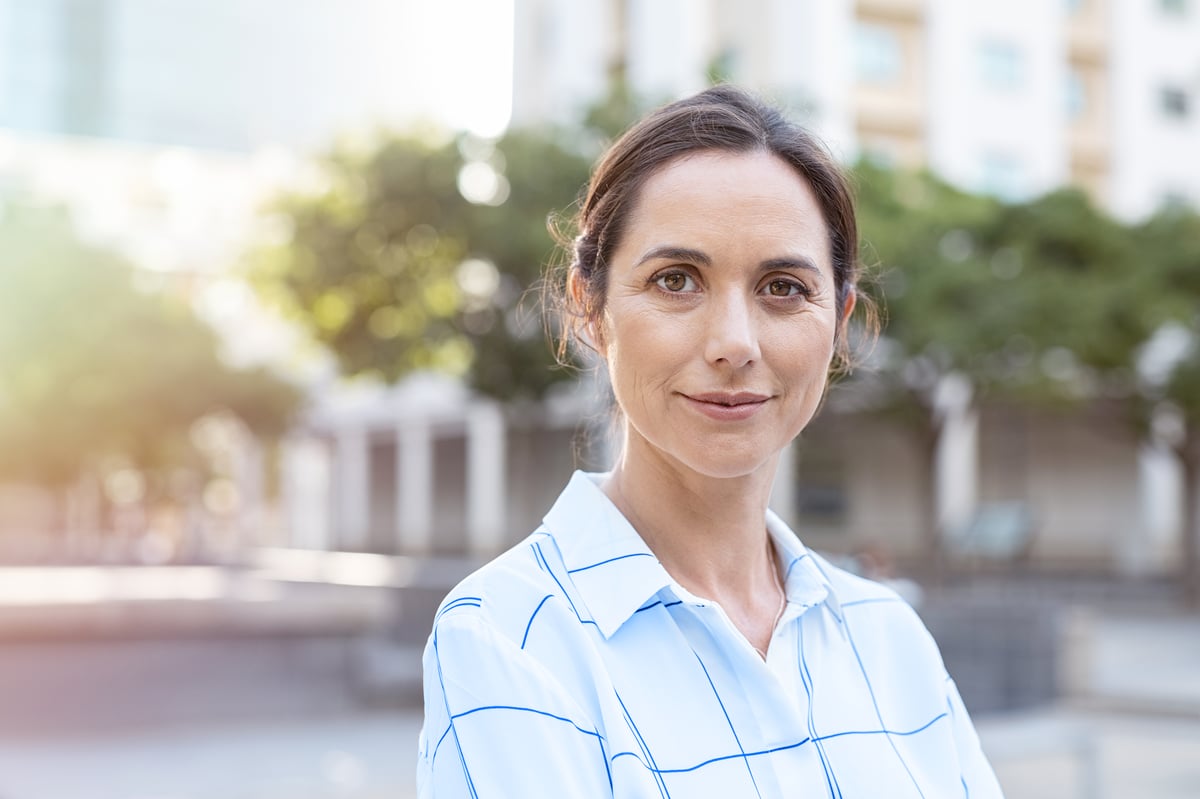 Female LGI employee smiling Join Our Team as an AI Augmented Developer